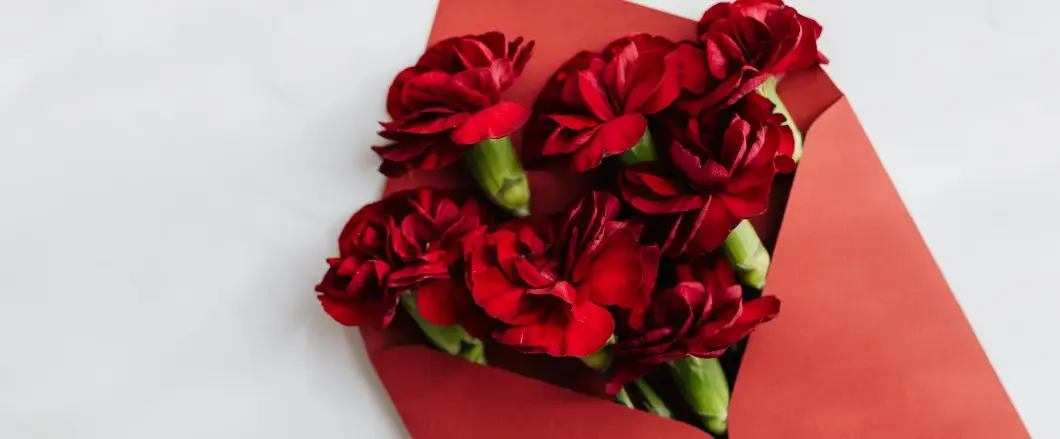Beautiful red and pink roses arranged in an elegant Valentine's Day bouquet, showcasing why roses became the symbol of love